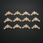cornières décoratives baroques ornements floraux bois beige clair artisanat meubles décoration intérieure appliques angle
