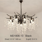 lustre moderne cristal K9 doré noir ampoules LED branches stylisées transparentes salon mariage