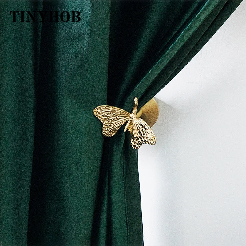 pince rideau dorée insectes anges détails sculptés quincaillerie fenêtre vintage opaques