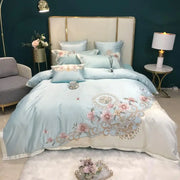 ensemble literie brodé motifs floraux couleurs bleu rose satin coton luxueux ornements complexes taies