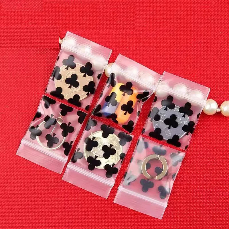 sachets plastique transparents motif cœurs noirs fermeture glissière pratique utilitaire variété tailles