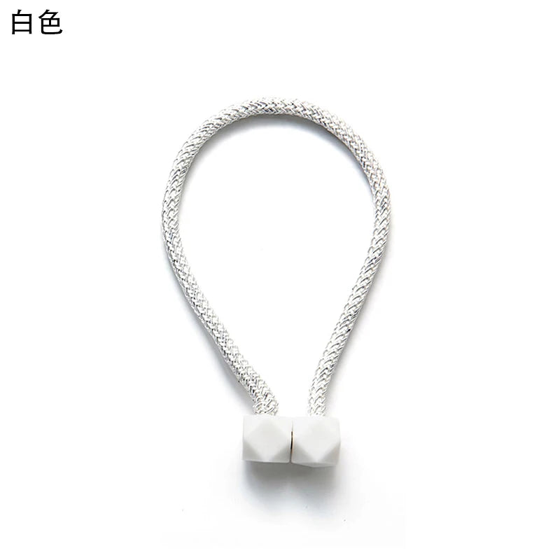 attaches rideaux décoratives modernes couleurs vives tressure cordée forme cube prismatique fixations nodales