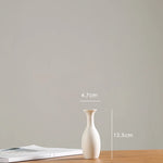 vases blancs modernes minimalistes céramique opaques fleurs artificielles table simple