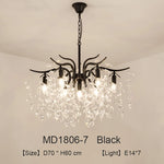 lustre moderne cristal K9 doré noir ampoules LED branches stylisées transparentes salon mariage