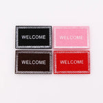 tapis d'entrée marron gris rose motif géométrique adhésif classique