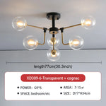 lampe suspension moderne sphères translucides structure dorée salon blanc nordique