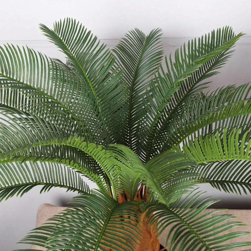 plante artificielle moderne feuilles vertes tronc texturé pot noir décoration intérieure feuilles fines branche