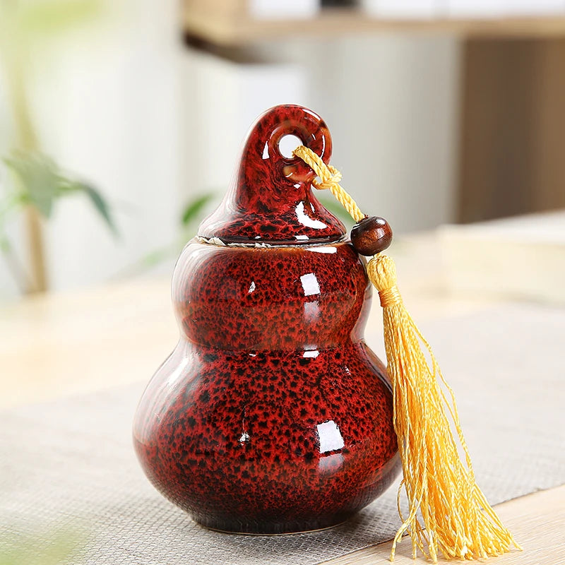 pot thé céramique vert brun artisanal couvercle anneaux pompon décoration maison stockage épices