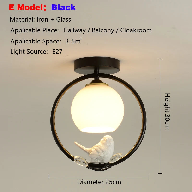 lampe moderne or noir oiseaux dorés branches sphère blanche translucide led echangement facile