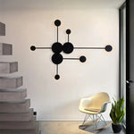 lampes murales modernes abstrait cercles tiges métalliques noir doré minimaliste têtes