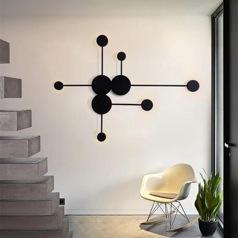 lampes murales modernes abstrait cercles tiges métalliques noir doré minimaliste têtes