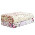 couverture matelassée fleurs patchwork rose violet géométrique frangée chambre coucher saisonnée