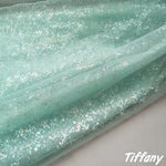 tissu polyester brillant effet paillettes moderne vert pastel rose violet bleu clair opaque décoration