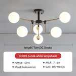 lampe suspension moderne sphères translucides structure dorée salon blanc nordique