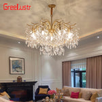 lustre moderne cristal K9 doré noir ampoules LED branches stylisées transparentes salon mariage