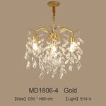 lustre moderne cristal K9 doré noir ampoules LED branches stylisées transparentes salon mariage