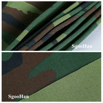 Voile d'ombrage camo utilisée comme abri pour chien