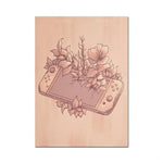 Une illustration délicate représentant des contrôleurs de jeu et des fleurs sur un fond rose, créant une composition élégante et artistique.