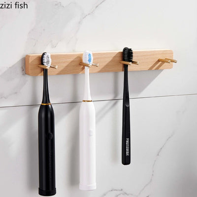 Porte brosse à dents mural en bois et laiton vert clair sur mur blanc