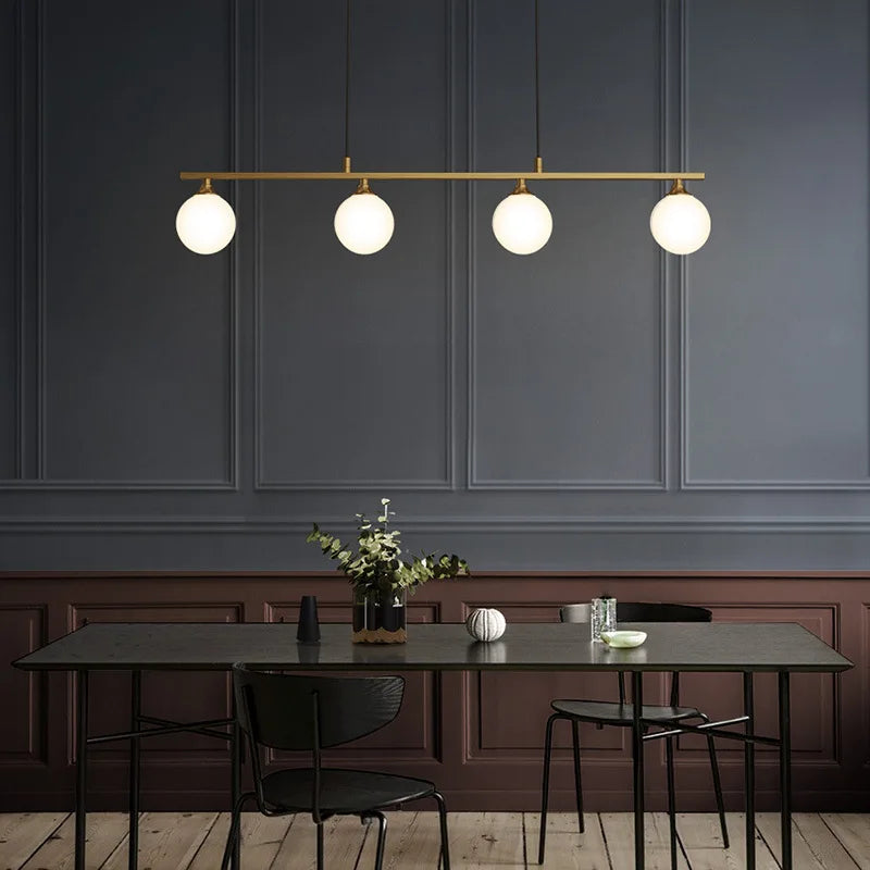 suspension lumineuse or blanc sphères translucides barre horizontale moderne minimaliste chambre salon