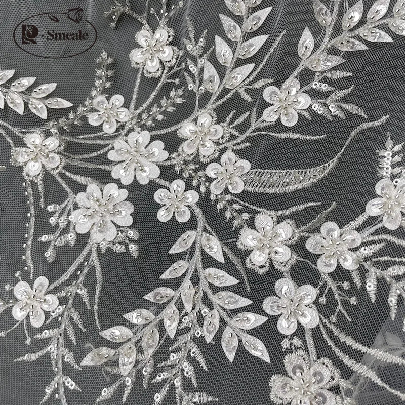 tissu dentelle transparent broderies fleurs brillantes élégant romantique création couture polyester