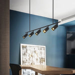 suspension lumineuse moderne noir doré tête brillante métal poli minimaliste