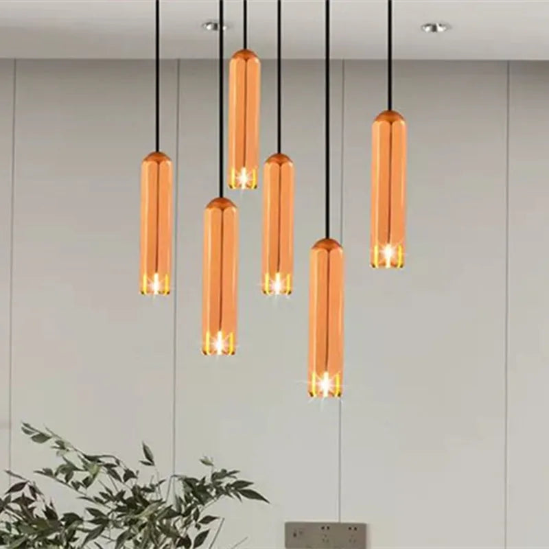 lampe suspendue or rose moderne facettes géométriques câble noir chambre salon