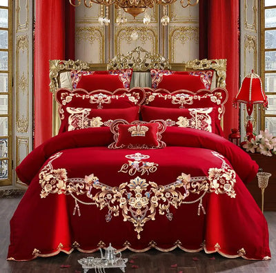 Parure de lit 220x240 en coton brodé rouge sur un lit queen