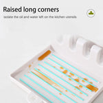 Porte-cuillères en plastique alimentaire avec différents ustensiles de cuisine