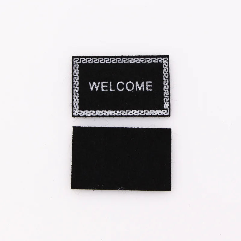 tapis d'entrée marron gris rose motif géométrique adhésif classique
