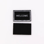 tapis d'entrée marron gris rose motif géométrique adhésif classique