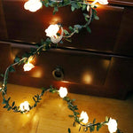 guirlande lumineuse fleurs blanches feuilles vertes clips romantique noël décoration chambre partie