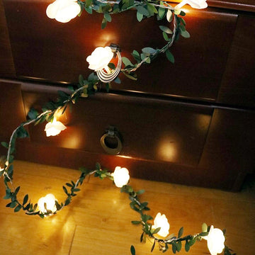 guirlande lumineuse fleurs blanches feuilles vertes clips romantique noël décoration chambre partie