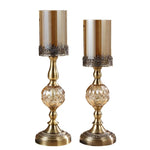 bougeoirs dorés transparents supports bougie colonne texture ornée vintage décoration maison chandelles floraux