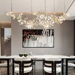 lampe suspendue feuilles gingko blanc doré contemporaine élégante salon chambre lumière chaînes porcelainière