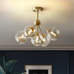 lustre moderne lumières doré sphères transparentes art déco contemporain led chambre salon