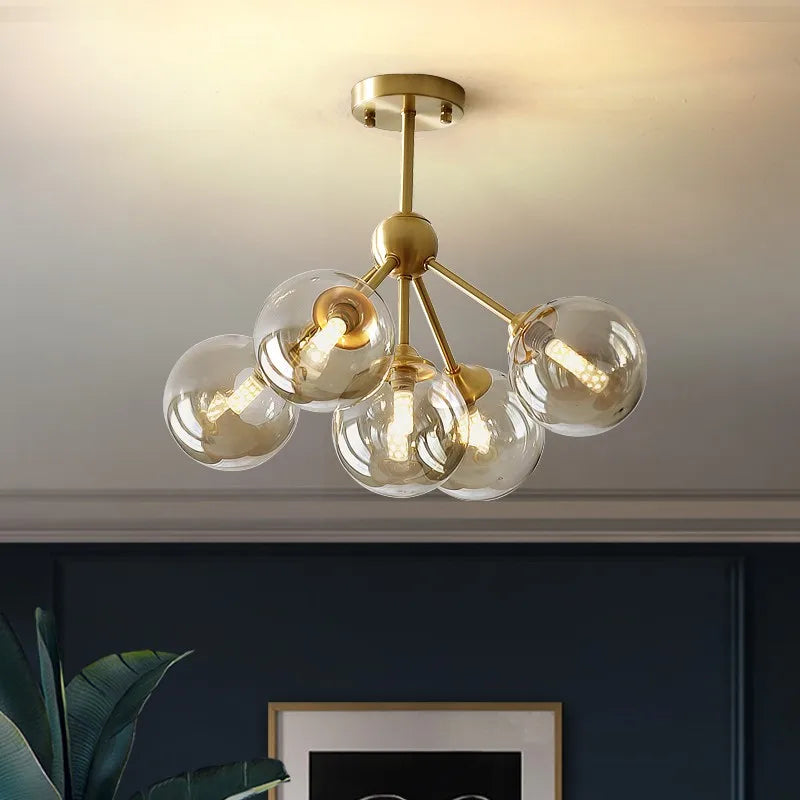 lustre moderne lumières doré sphères transparentes art déco contemporain led chambre salon