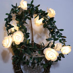 guirlande lumineuse fleurs blanches feuilles vertes clips romantique noël décoration chambre partie