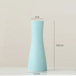vases blancs modernes minimalistes céramique opaques fleurs artificielles table simple