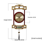 horloge murale bois chinois cadres dorés marron motif géométrique aiguilles dorées classique
