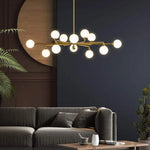 suspension lumineuse moderne or blanc sphères translucides structure métallique interrupteur tactile led