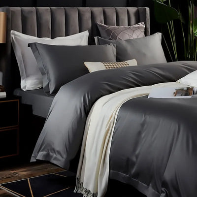 Parure de lit réversible gris en coton égyptien sur un lit double