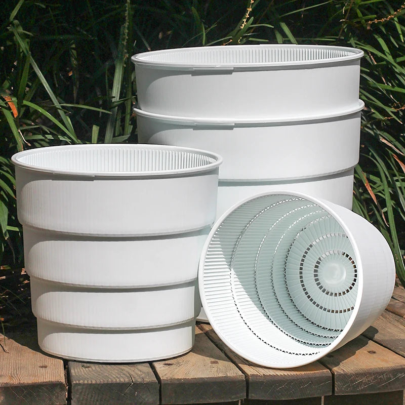 Cache-pot plastique rose pour plante verte intérieur