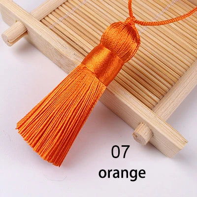 pompons soie polyester 5cm longueur 18cm corde noir rose rouge vert jaune bleu modernes