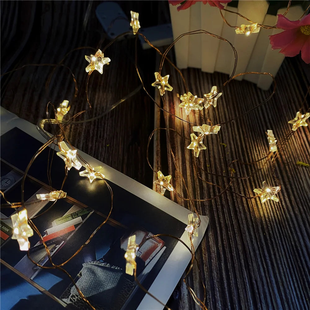 guirlande lumineuse étoiles transparentes blanc doré moderne clips câbles fins décoration noël festive intérieure