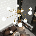 suspension lumineuse moderne or blanc sphères translucides structure métallique interrupteur tactile led