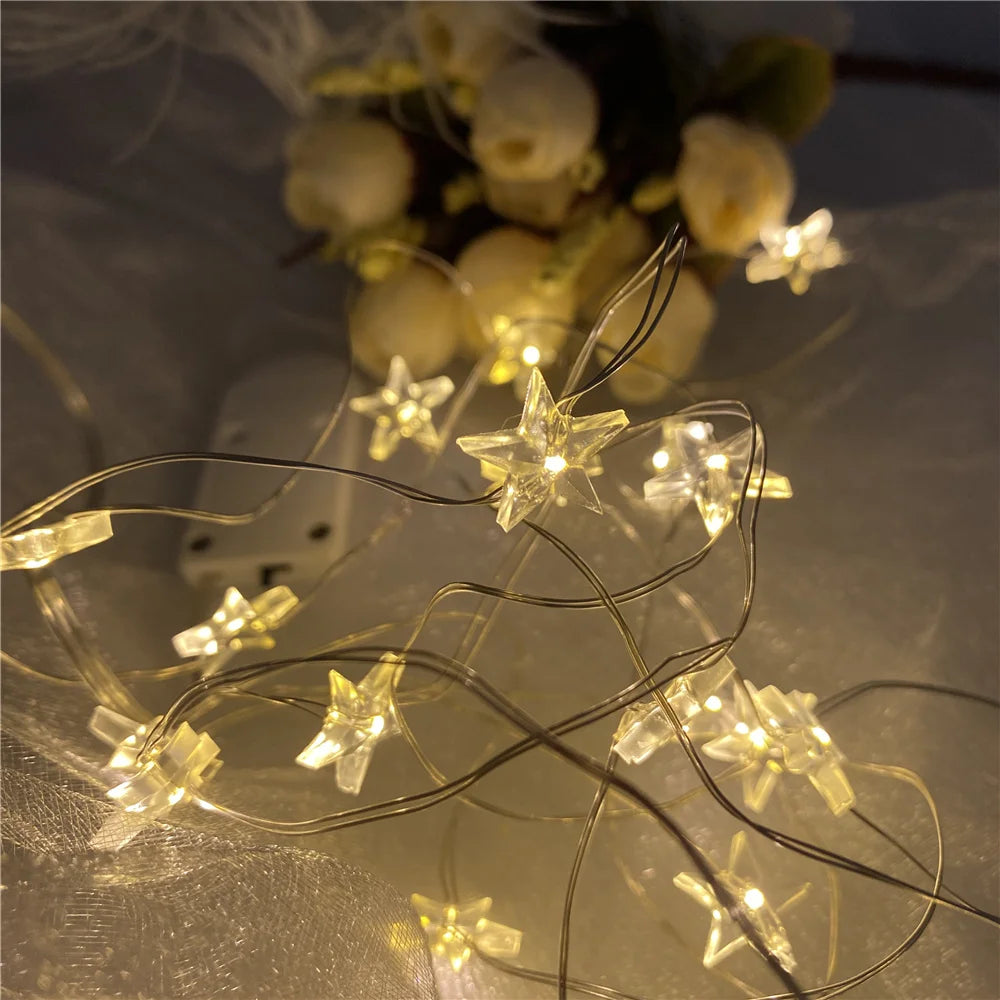 guirlande lumineuse étoiles transparentes blanc doré moderne clips câbles fins décoration noël festive intérieure