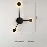 lampes murales modernes abstrait cercles tiges métalliques noir doré minimaliste têtes