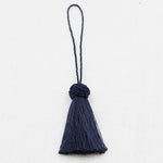 pompons franges decoration maison beige gris blanc bleu marine noir tissu élégant