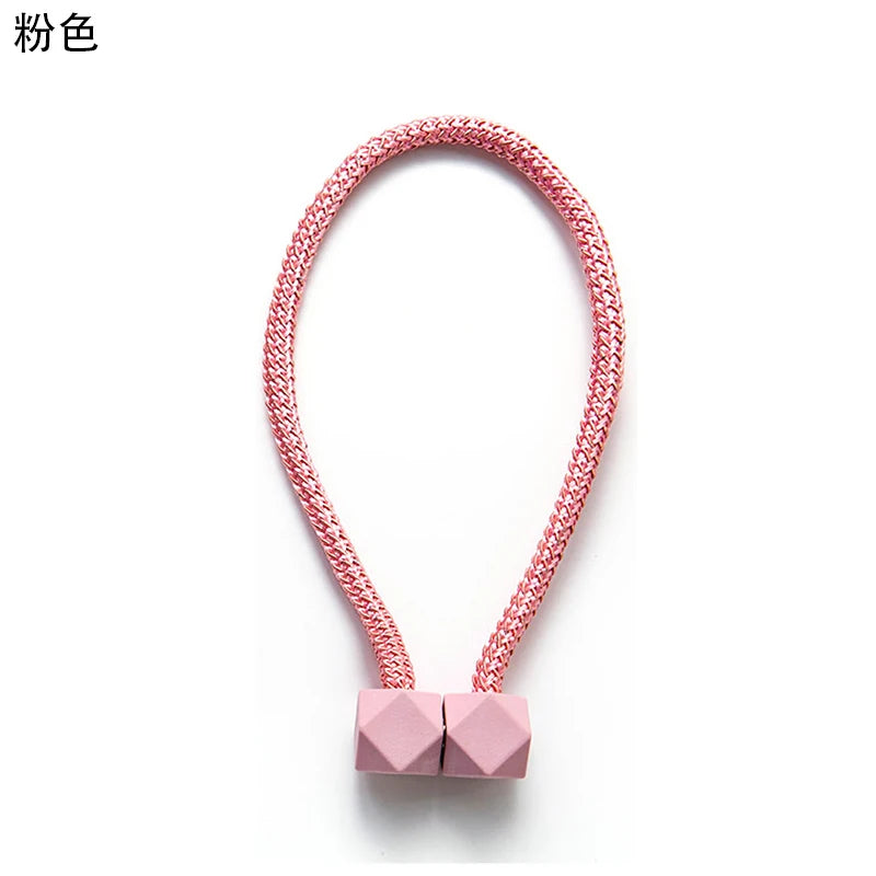 attaches rideaux décoratives modernes couleurs vives tressure cordée forme cube prismatique fixations nodales